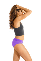 Dear Kate Ada Hipster Mini in Electric Blue worn on model, back view on a white background.