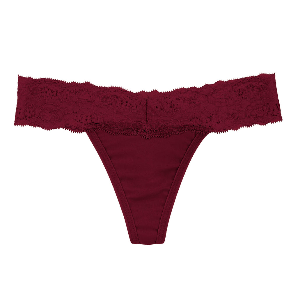 Dear Kate Ada Thong worn on model in Black, alternate front view on a white background.