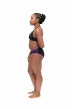Dear Kate Hazel Hipster Mini worn on model, lifestyle back view on a white background.