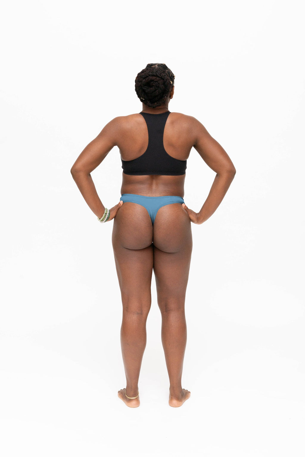 Dear Kate Nellie Thong in Dusty Teal, back view on a white background.