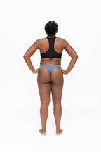 Dear Kate Nellie Thong in Dusty Teal, back view on a white background.