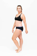 Dear Kate Hazel Hipster Mini worn on model, side view on a white background.