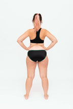 Dear Kate Hazel Hipster Full in Emerald, worn on model, back view on a white background.