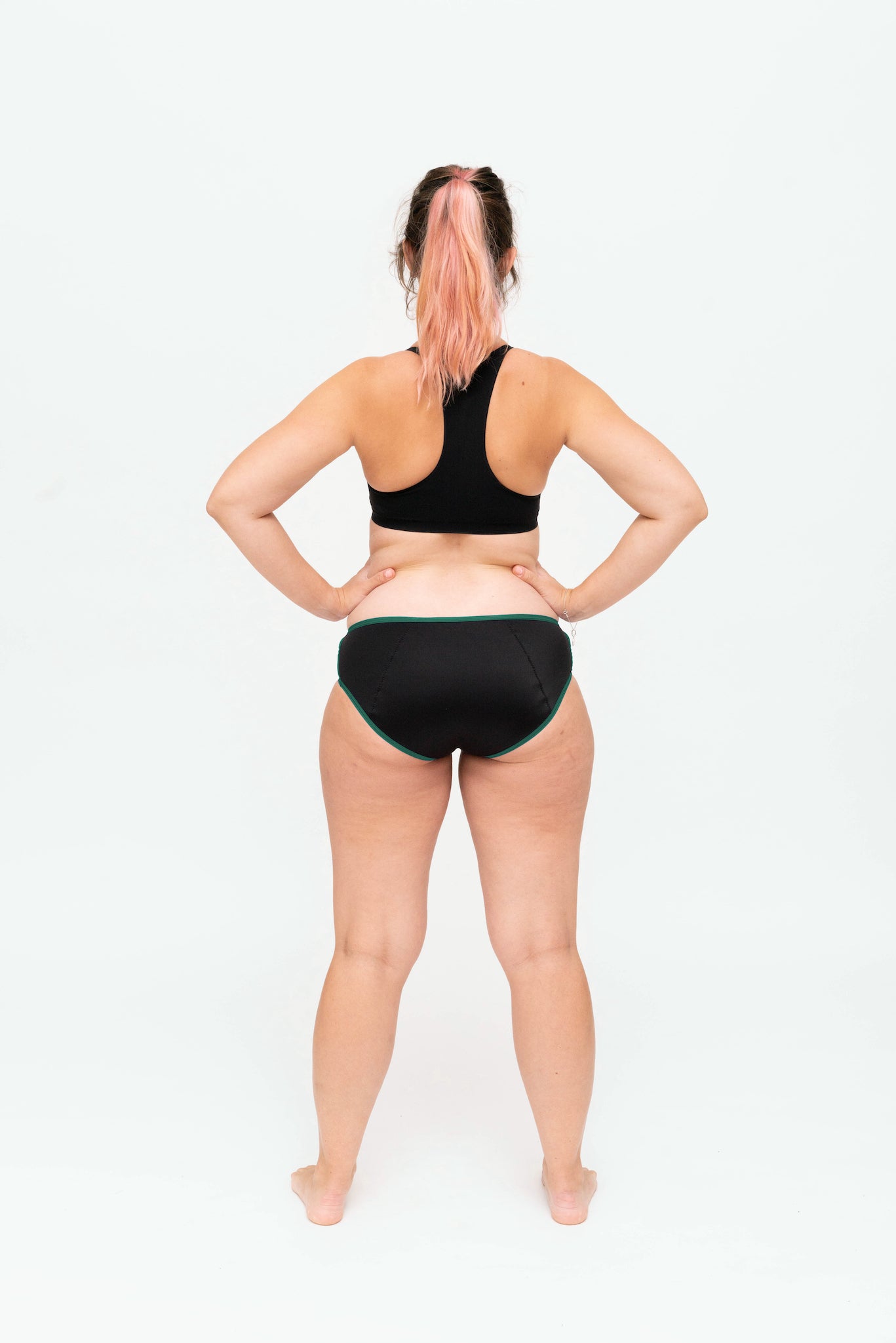 Dear Kate Hazel Hipster Full in Emerald, worn on model, back view on a white background.