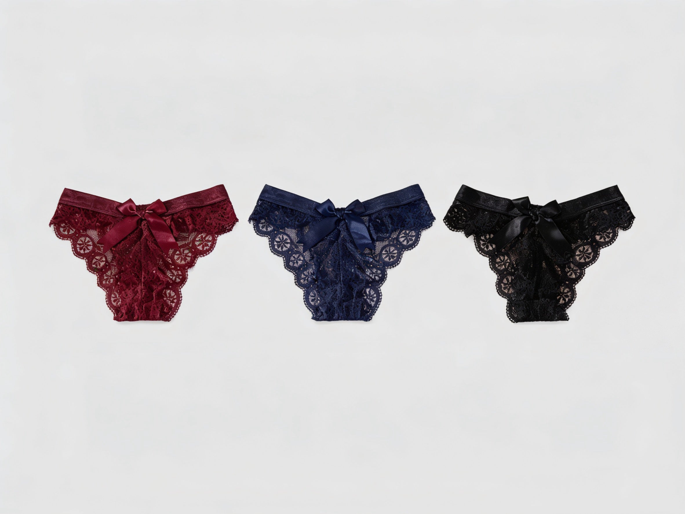 Forest Summer 3-Pack Lace Bow Cheeky Panty, flat lay view on a white background.