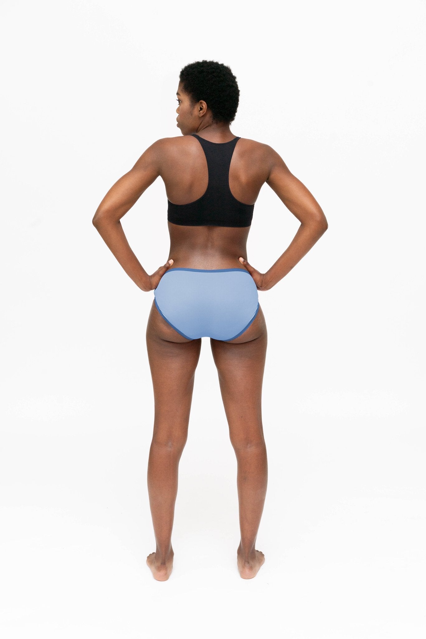 Dear Kate Hazel Hipster Mini worn on model, back view on a white background.