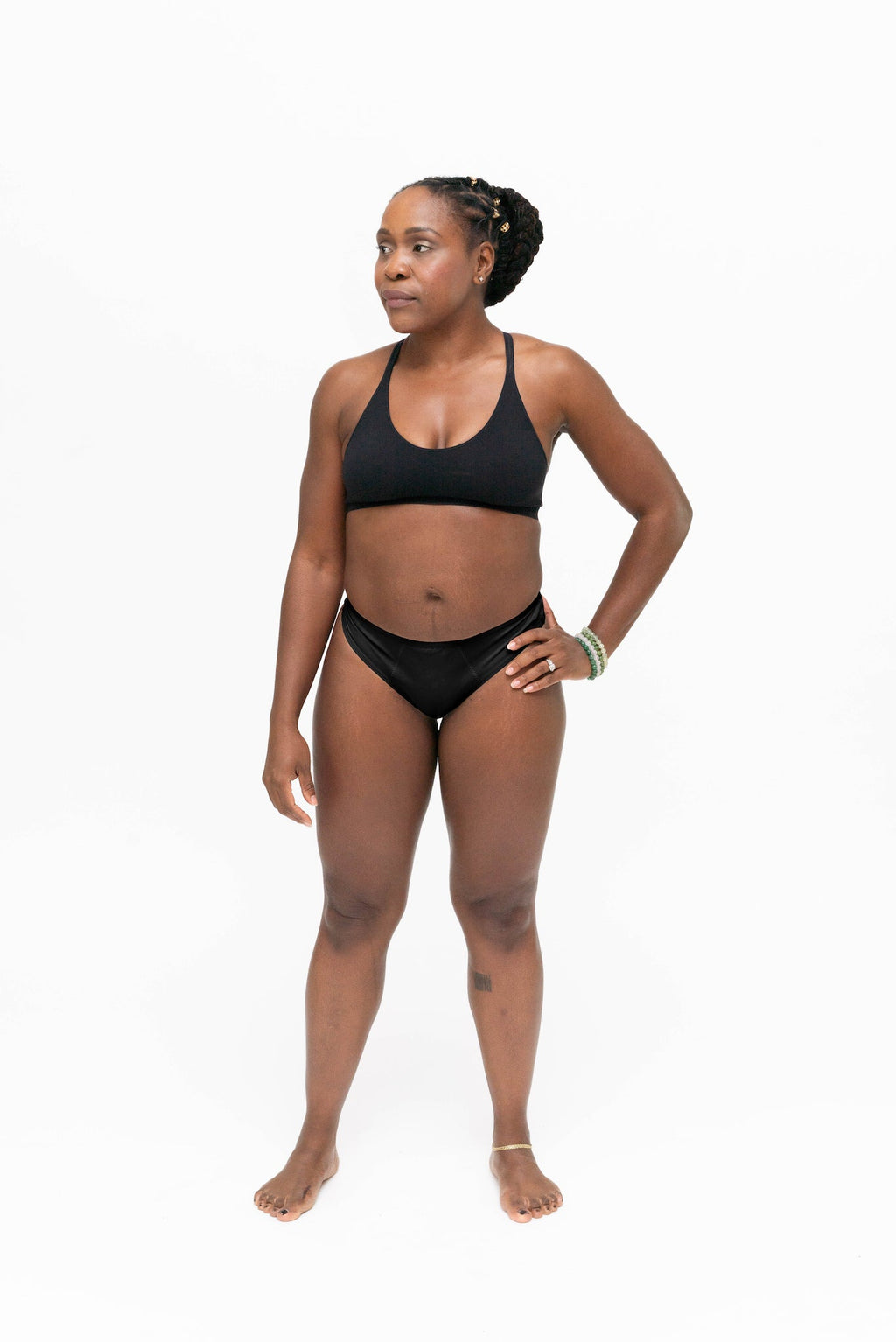 Dear Kate Nellie Thong in Black, front view on a white background.