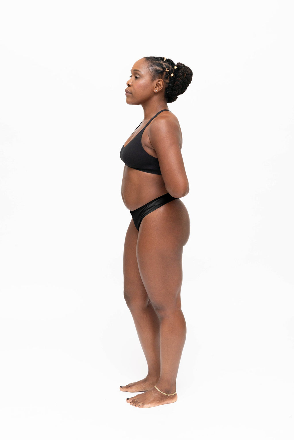 Dear Kate Nellie Thong in Black, back view on a white background.