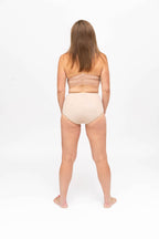 Dear Kate Nellie Brief Full in Beige, rear view worn on model on a white background.