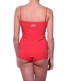 Full length rear view of a model wearing Ginch Gonch red atomic fireballs cami cotton stretch tank top with a white background.