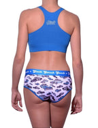 Full length rear view of a model wearing Ginch Gonch Busted Boyfriend Briefs with a matching sports bra, featuring a high-coverage fit.