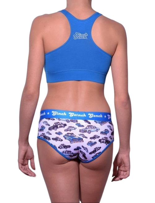 Full length rear view of a model wearing Ginch Gonch Busted Boyfriend Briefs with a matching sports bra, featuring a high-coverage fit.