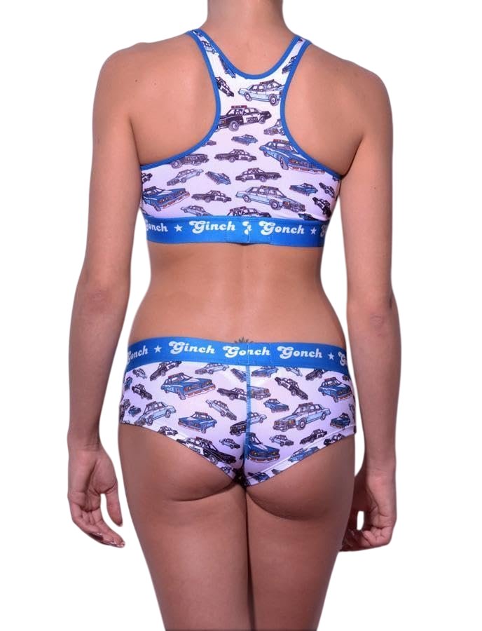 Rear view of a model wearing Ginch Gonch Busted Gogo Briefs with a matching sports bra and an an all-over police car chase print.