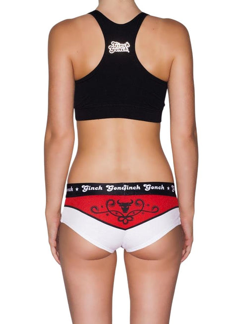Rear view of a model wearing Ginch Gonch El Toro Gogo Briefs with a matching black sports bra, featuring a bull-rider print and cotton stretch details.