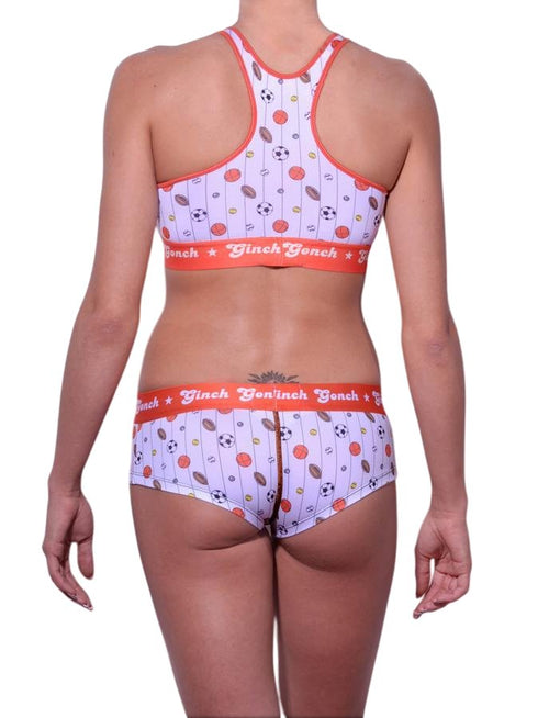 Full length rear view of a model wearing Ginch Gonch gogo brief white color with sporty print stretchable cotton underwear with a matching sports bra and a white background.