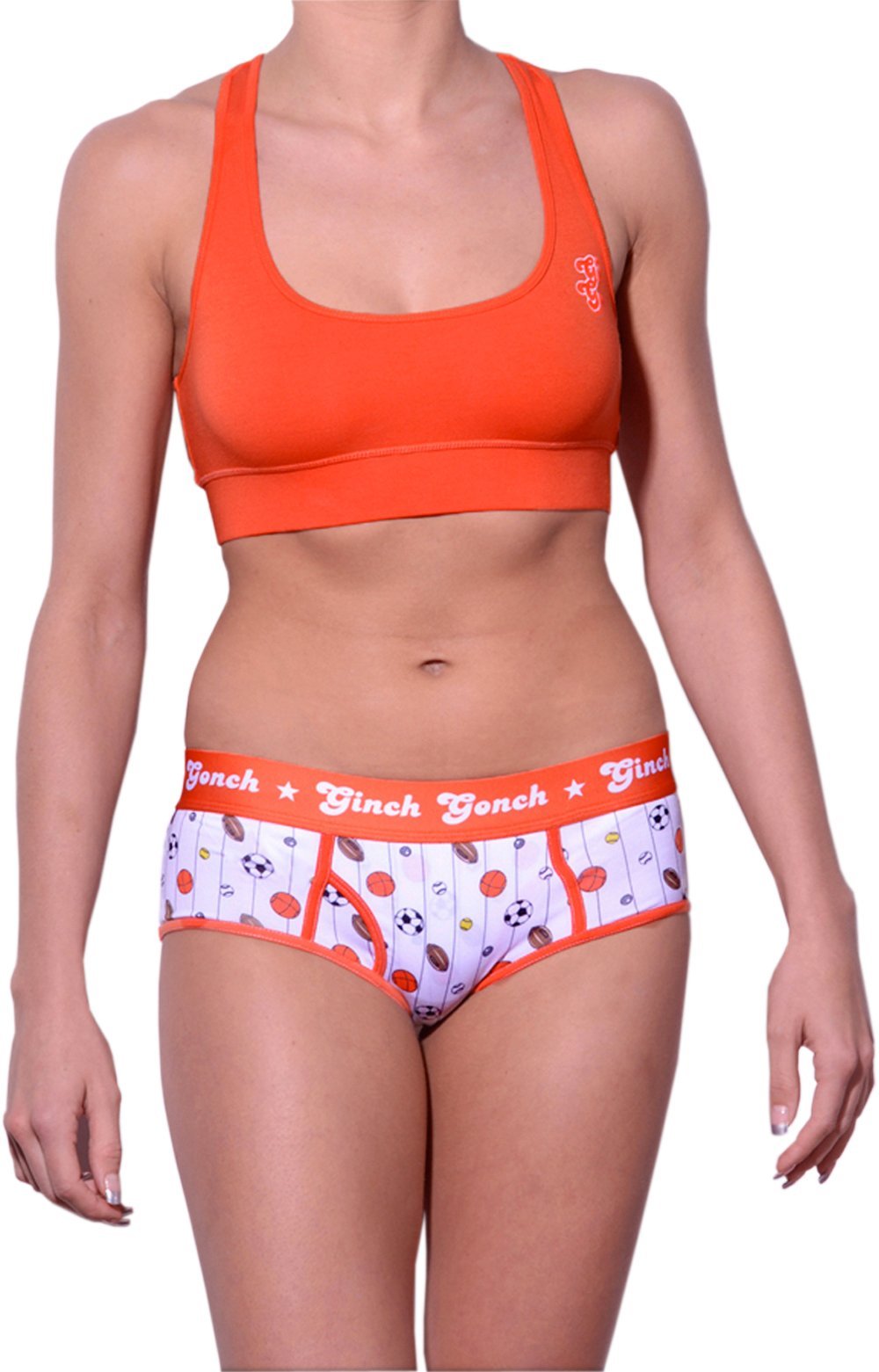 Ginch Gonch orange color boyfriend brief stretchable cotton underwear panty worn with an orange sports bra by a model with a white background.