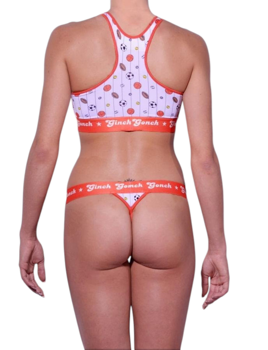 Full length rear view of a model wearing Ginch Gonch Hardball Gogo Briefs and matching sports bra with all-over sports print and anti-muffin-top waistband.
