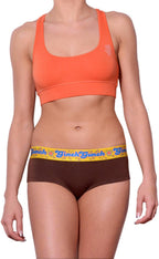 Ginch Gonch gogo brief brown color stretchable cotton worn with an orange sports bra by a model with a white background.