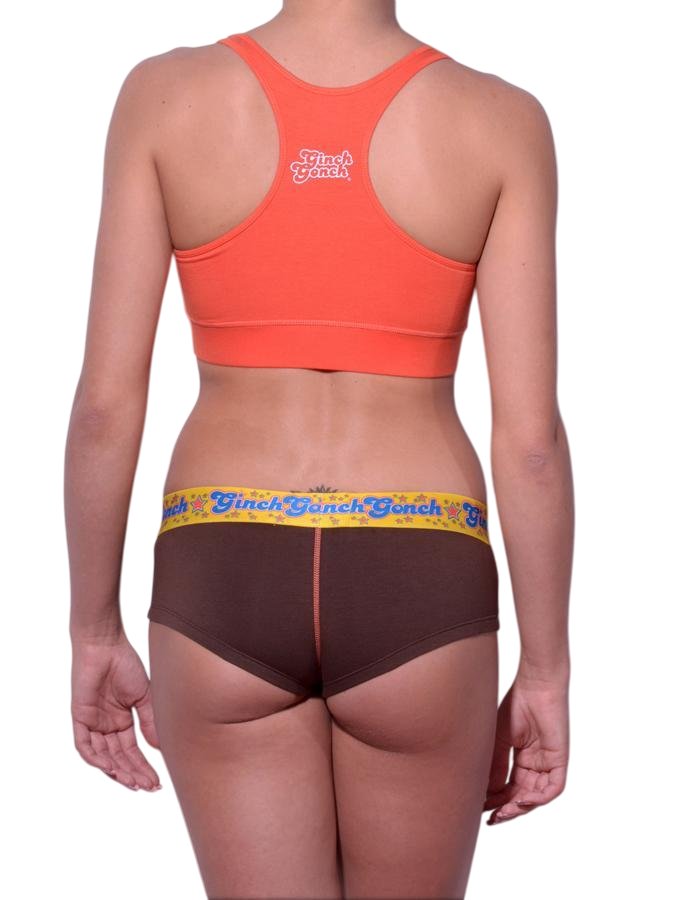 Full length rear view of a model wearing Ginch Gonch brown gogo cotton stretch brief with an orange sports bra.