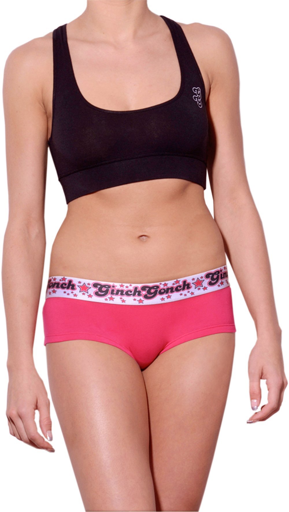 Ginch Gonch gogo brief pink and white color stretchable cotton underwear worn with a black sports bra by a model with a white background.