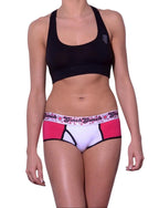 Ginch Gonch boyfriend brief pink and white color stretchable cotton worn with a black sports bra by a model with a white background.