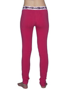 Full length rear view of a model wearing Ginch Gonch pink leggings with a white background.