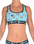 Ginch Gonch Monkey Business Women's Sports Bra, aqua blue with black underband, all-over monkey banana print, 4-way stretch cotton, waist-up on model.