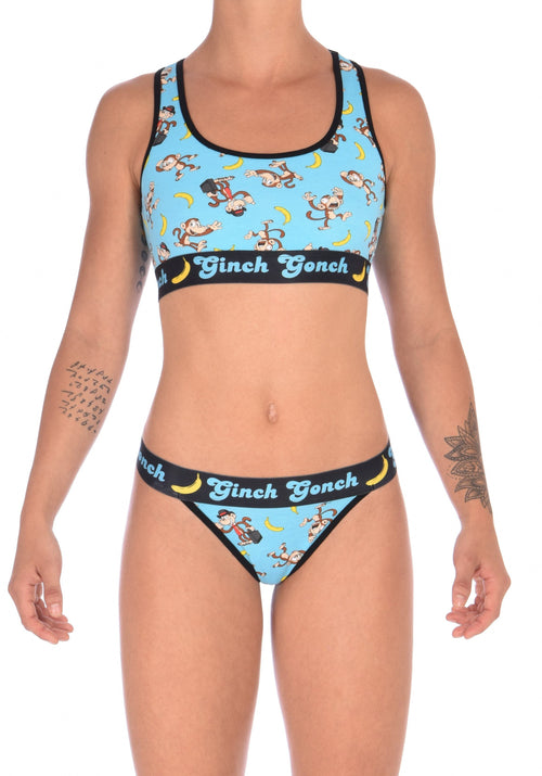 Ginch Gonch Monkey Business Women's Thong, aqua monkey print with black waistband, thong cut, anti muffin-top waistband worn by a model with matching sports bra.