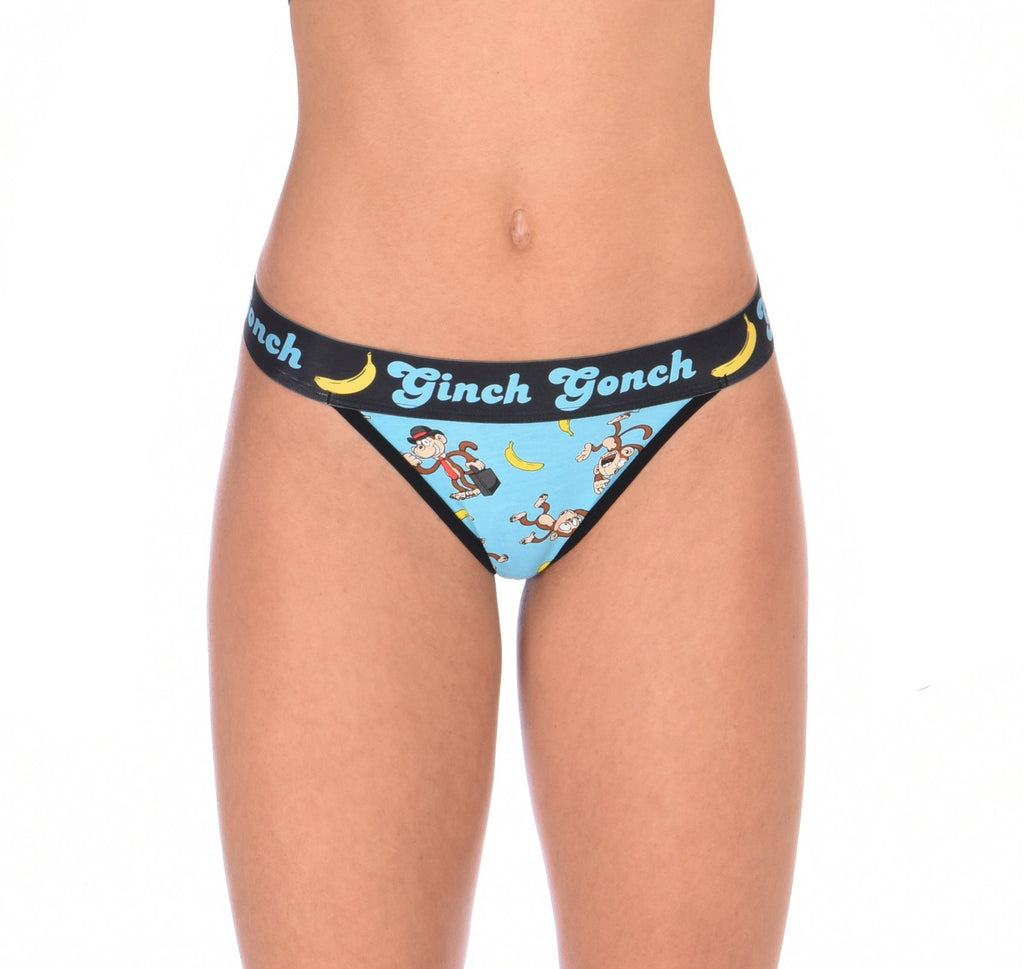 Ginch Gonch Monkey Business Women's Thong, aqua blue with black waistband and monkey banana print, anti muffin-top, stretch cotton, close-up on model.