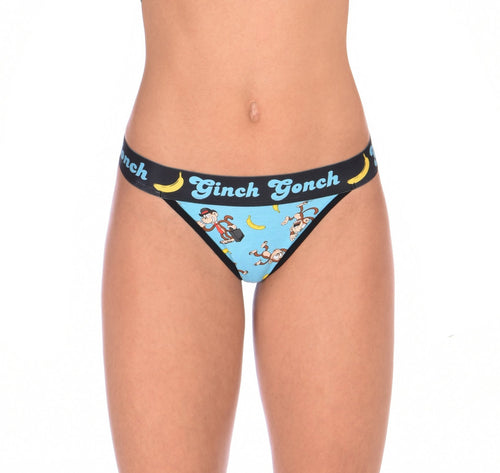 Ginch Gonch Monkey Business Women's Thong, aqua blue with black waistband and monkey banana print, anti muffin-top, stretch cotton, close-up on model.
