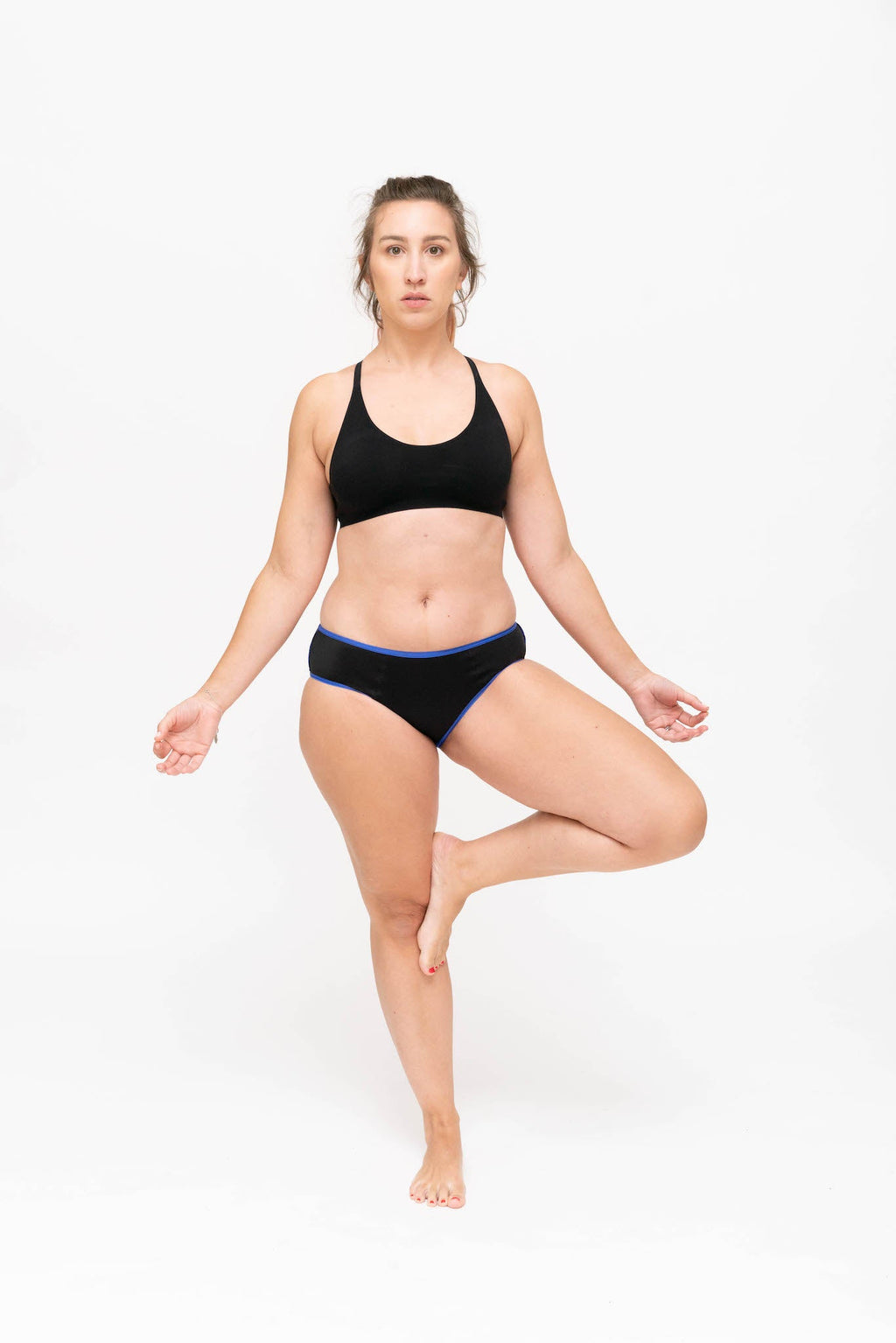 Dear Kate Hazel Hipster Full in Black, worn on model in yoga pose on a white background.