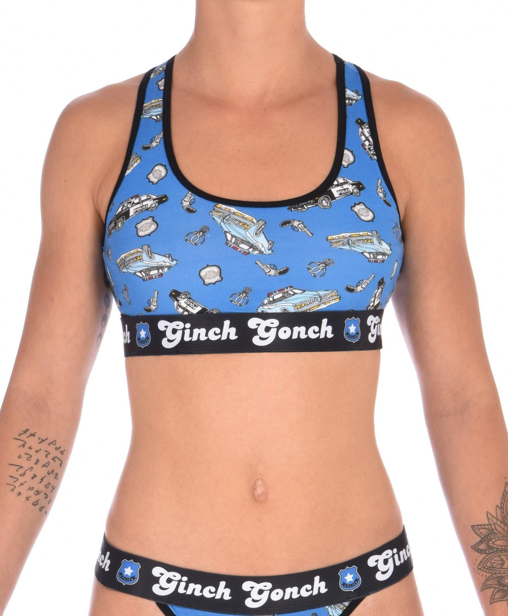 Ginch Gonch GG Patrol Women's blue racerback sports bra in old-school police print, 4-way stretch cotton wire-free bralette worn by a model.