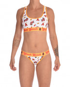 Full view of a model wearing a Ginch Gonch GG Fire Fighters thong showing minimal coverage and firefighter print stretch cotton paired with a matching sports bra.