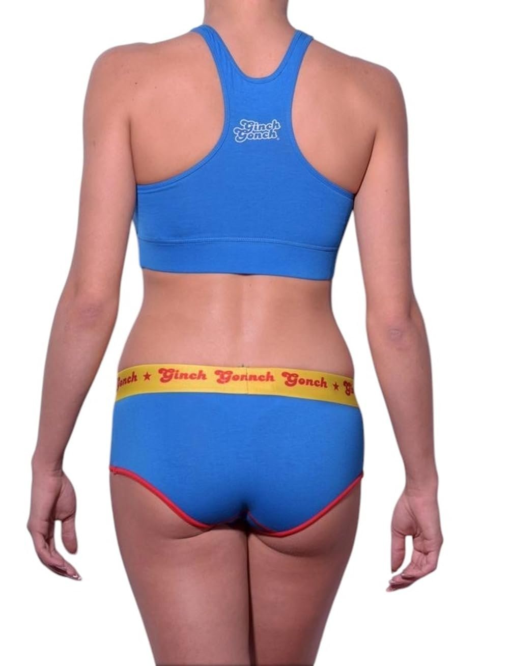 Rear view of a model wearing Ginch Gonch Ginchcredible blue boyfriend briefs showing full coverage and superhero print stretch cotton.