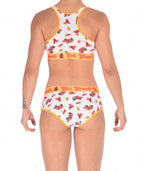 From the back of a model wearing a Ginch Gonch GG Fire Fighters boyfriend briefs showing full seat coverage and firefighter print cotton and same printed sports bra.