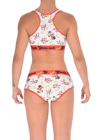 Rear view of a model Ginch Gonch Gone Bananas boyfriend briefs showing full seat coverage and monkey print stretch cotton with matching sports bra.