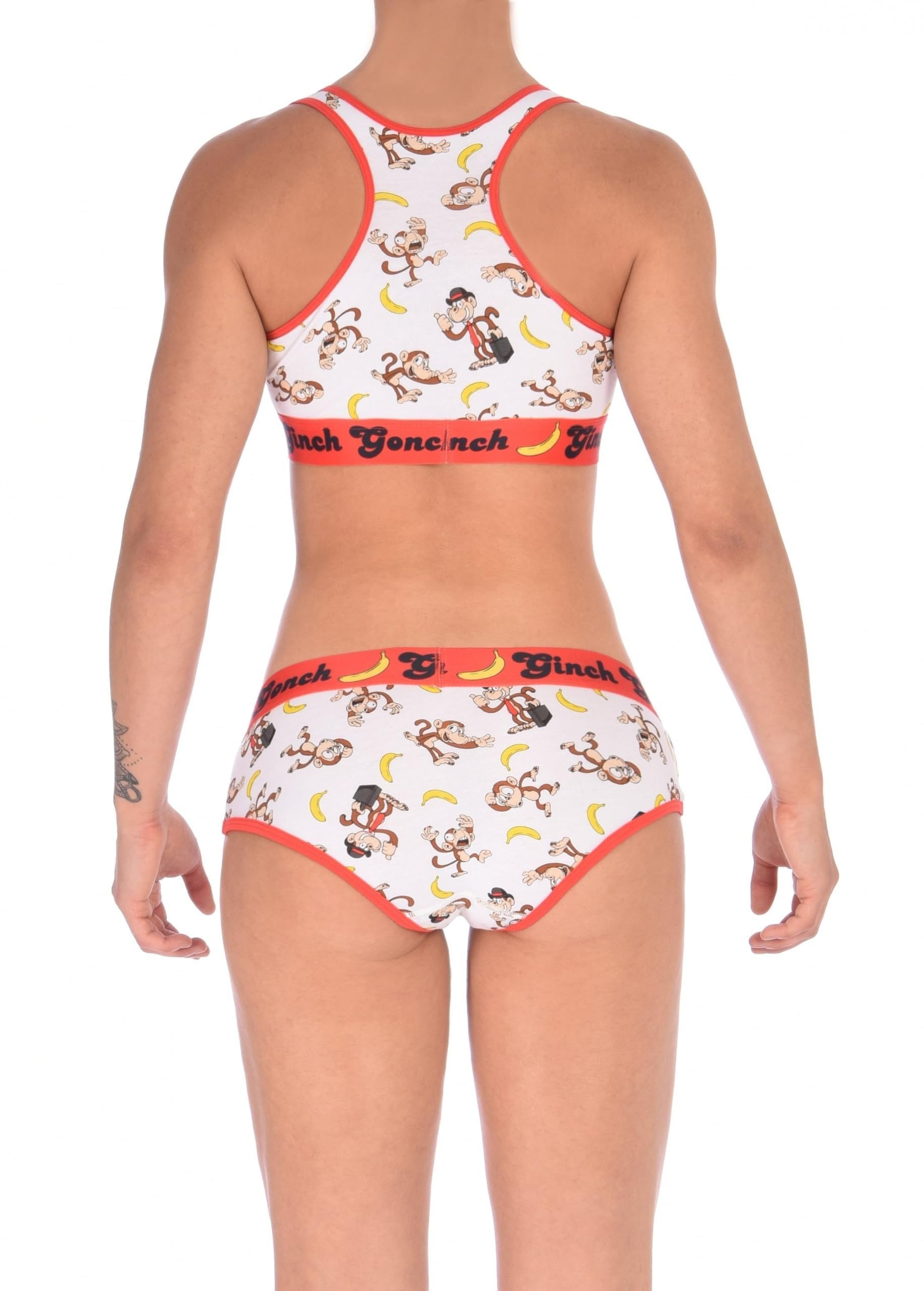 Rear view of a model Ginch Gonch Gone Bananas boyfriend briefs showing full seat coverage and monkey print stretch cotton with matching sports bra.