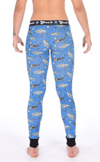 Rear view a model wearing view of Ginch Gonch GG Patrol blue leggings showing full-length police print stretch cotton and anti-muffin waistband.