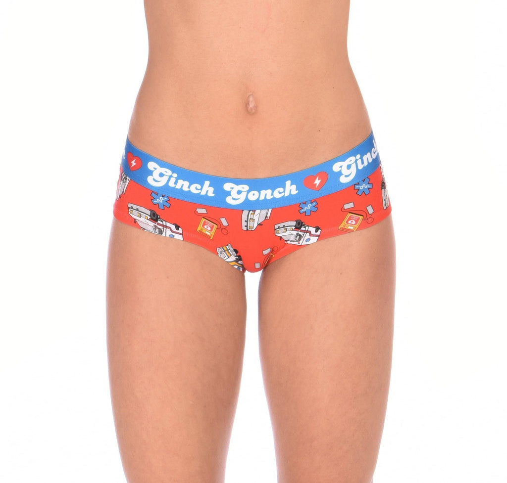 Ginch Gonch GG EMT Women's gogo briefs in orange playful medical-themed print, 4-way stretch cotton low-rise bikini cut, worn by a model.
