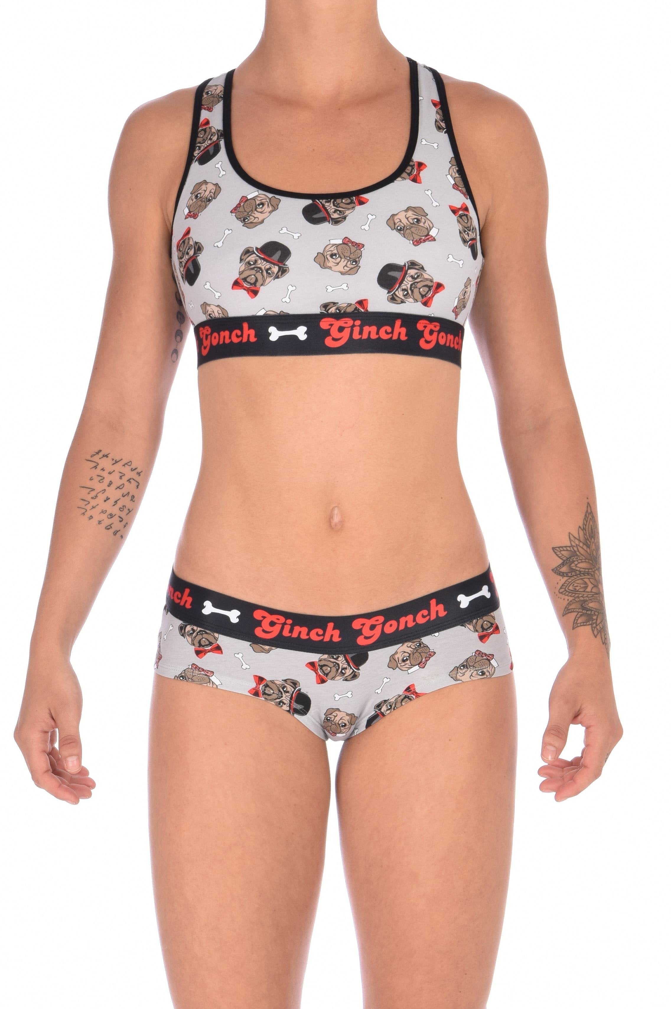 Front view of a model wearing a Ginch Gonch Pug Life grey gogo briefs showing anti-muffin waistband and pug print stretch cotton with matching printed sports bra.