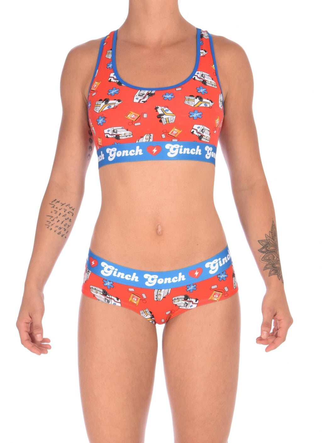 Full version view of a model wearing a Ginch Gonch GG EMT gogo briefs showing anti-muffin waistband and medical print stretch cotton set with the matching sports bra.