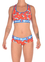 Full version view of a model wearing a Ginch Gonch GG EMT gogo briefs showing anti-muffin waistband and medical print stretch cotton set with the matching sports bra.