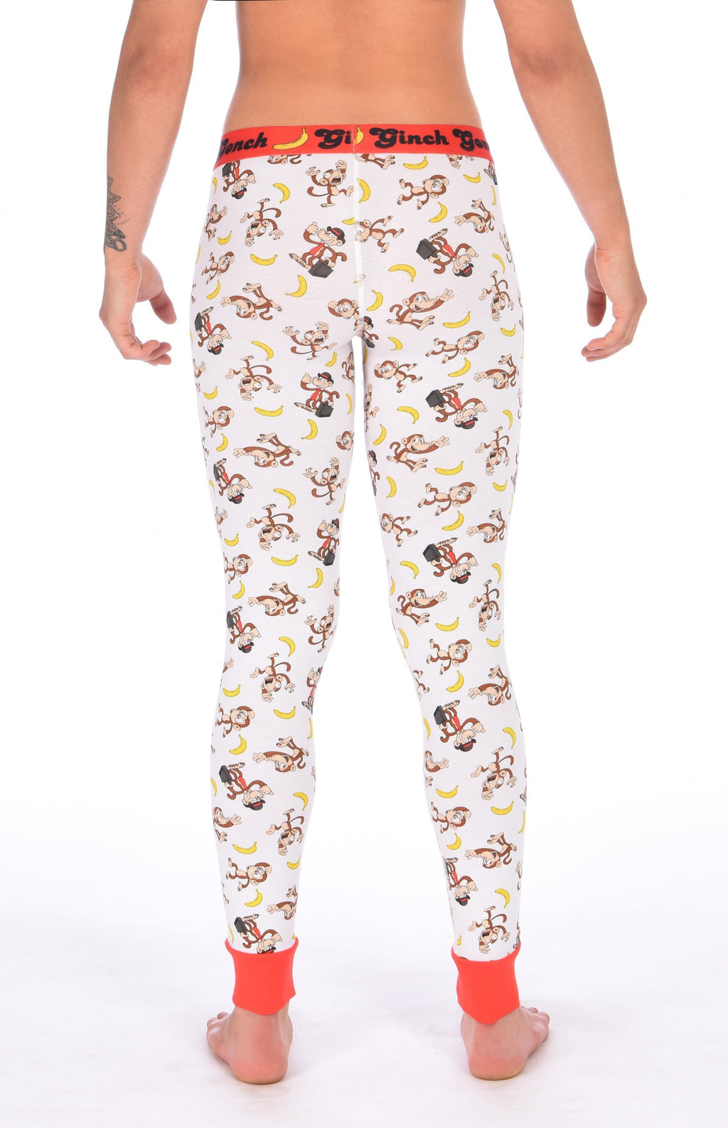 Rear view of a model wearing a Ginch Gonch Gone Bananas leggings showing full-length monkey print stretch cotton and anti-muffin waistband