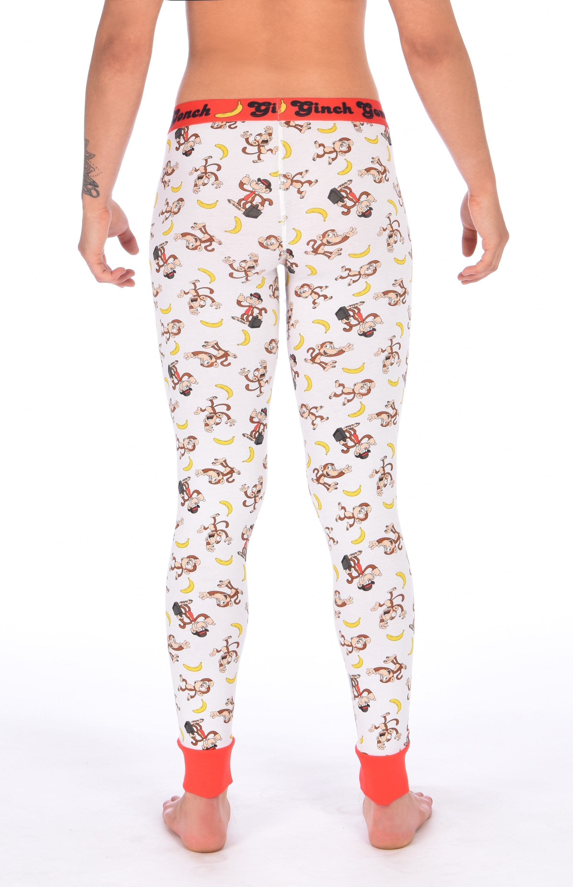 Rear view of a model wearing a Ginch Gonch Gone Bananas leggings showing full-length monkey print stretch cotton and anti-muffin waistband