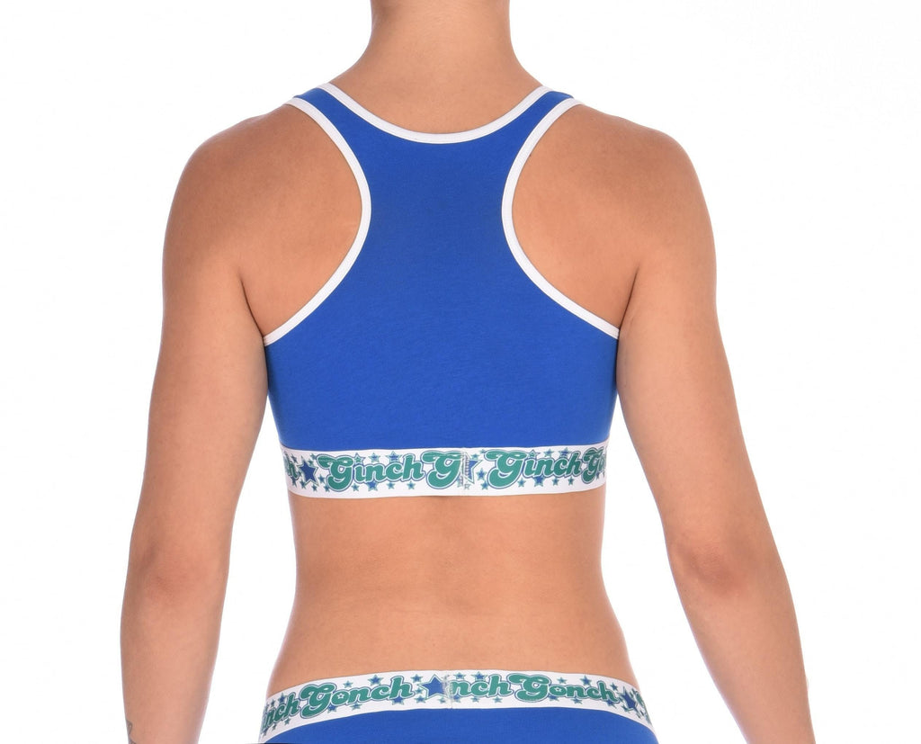 Rear view of Ginch Gonch Blue Lagoon sports bra showing racerback strap design in solid royal blue stretch cotton
worn by a model