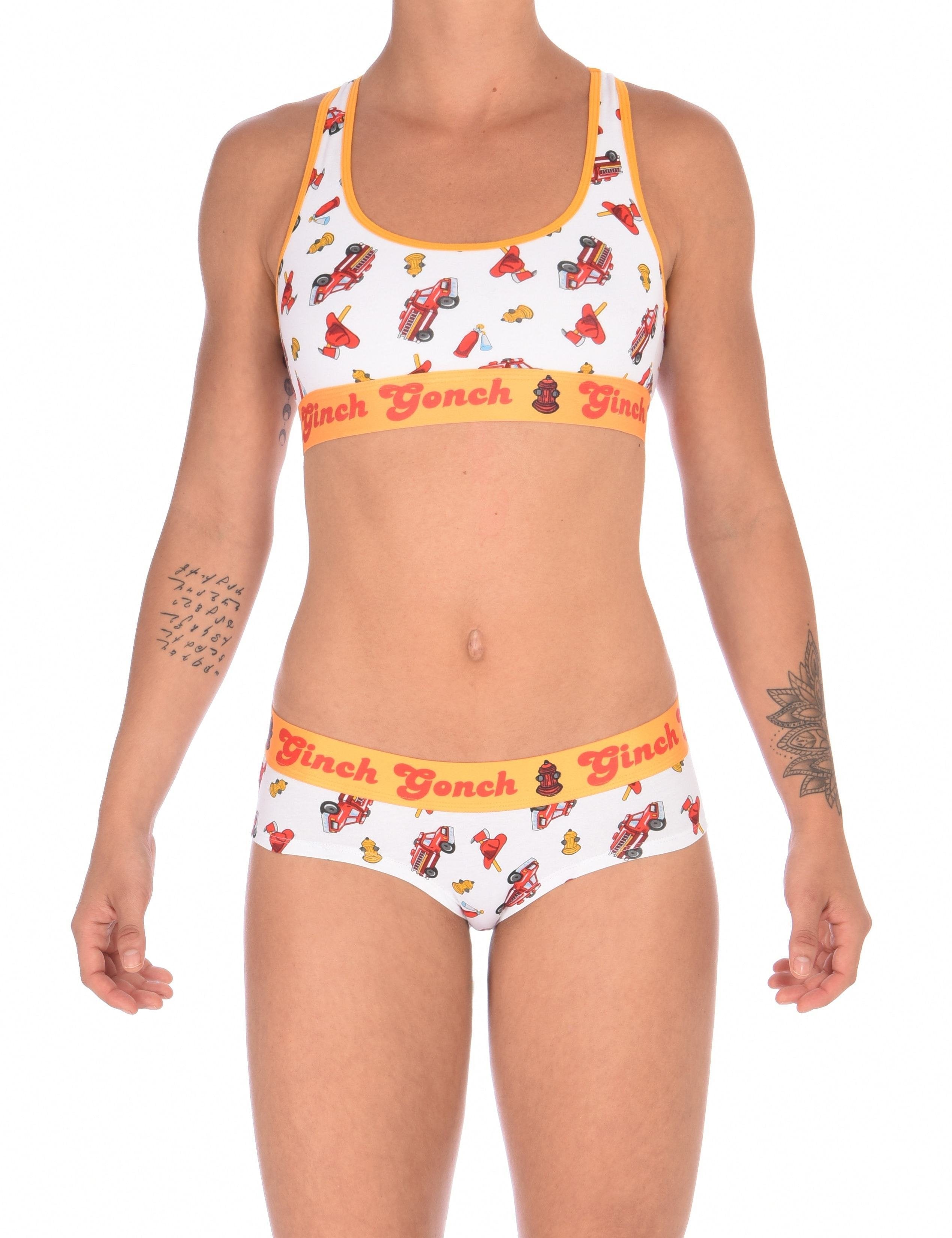 Full oufit view of a model wearingGinch Gonch GG Fire Fighters gogo briefs showing anti-muffin waistband and firefighter print cotton with amatching sports bra.