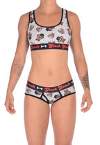 Front view of a model wearing a Ginch Gonch Pug Life grey boyfriend briefs showing full seat coverage and pug print stretch cotton fabric with a same sports bra.