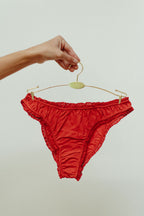 Paulette & Maria Auburn organic cotton frilly panties, front view on a white background.