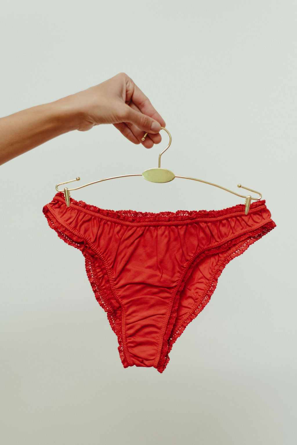 Paulette & Maria Auburn organic cotton frilly panties, front view on a white background.