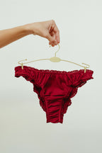 Paulette & Maria Burgundy organic cotton frilly panties, front view on a white background.